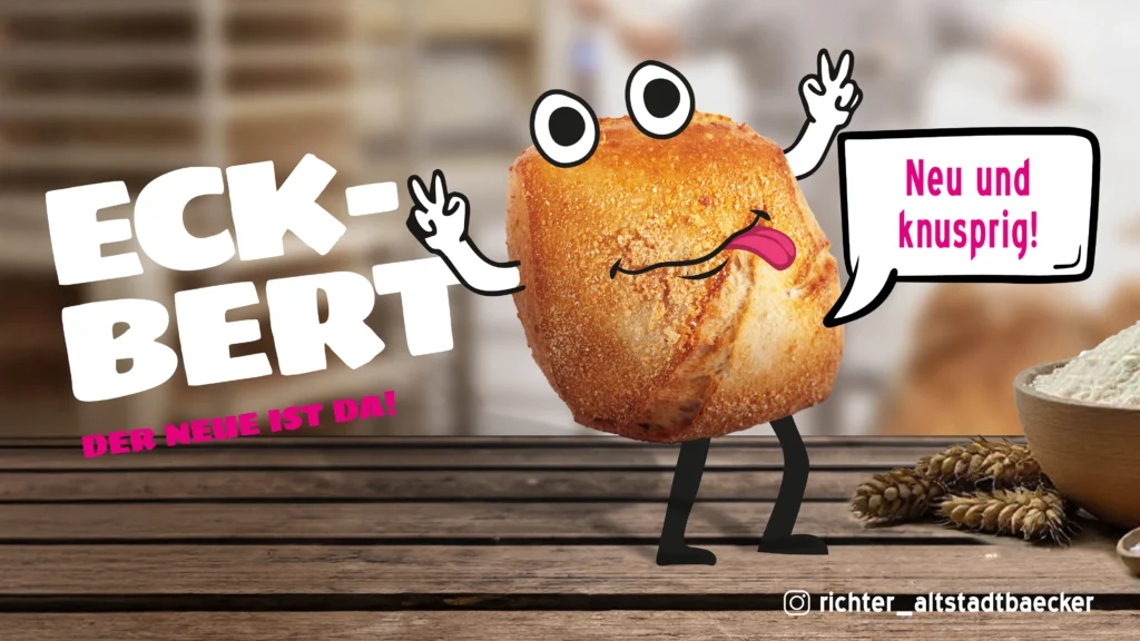 Ein Comic-Brötchen mit Armen, Beinen und einem lächelnden Gesicht steht auf einem Holztisch und sagt in einer Sprechblase: „Neu und knusprig!“. In großen Buchstaben steht „ECK-BERT. DER NEUE IST DA!“. Daneben liegen Mehl und Weizen.